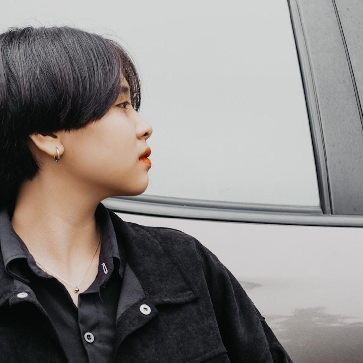 Avery Lane, Lead Design Curator at Universal System Framework, reviewing corporate floral arrangements